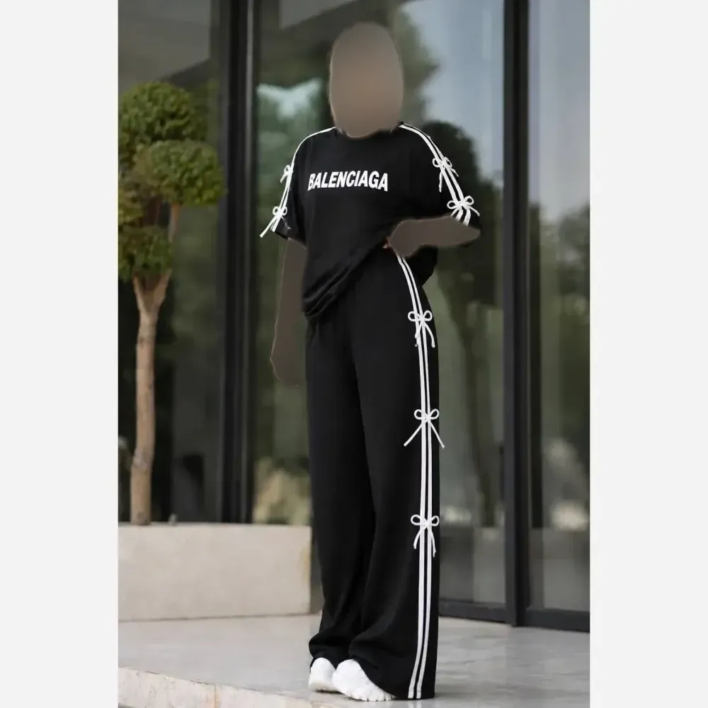 ست تیشرت و شلوار زنانه طرح پاپیون جنس اسپان گلکسی رنگ مشکی سایز فری سایز